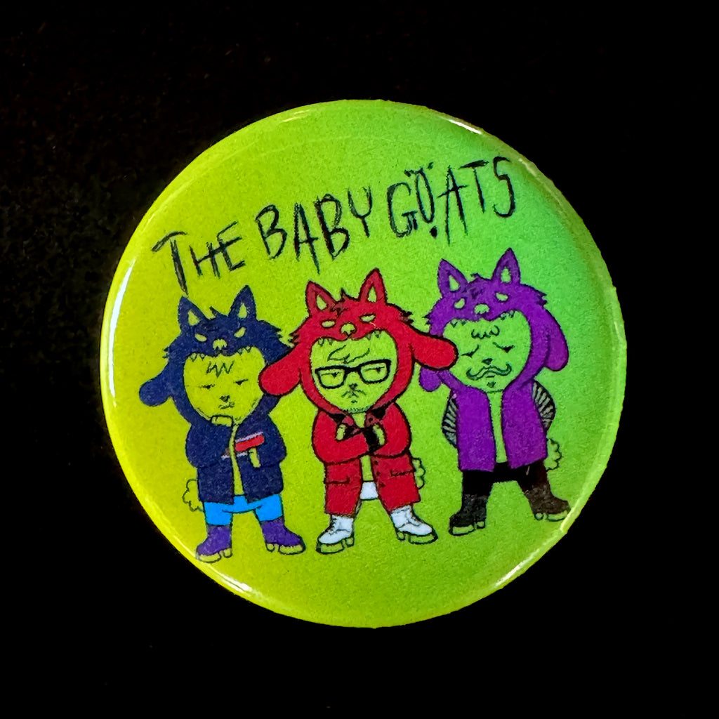 Button with 'The Baby Goats' design on a green background