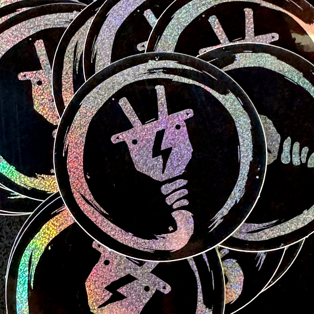 Stack of round, glitter Electricity Baby Goats stickers on a black background